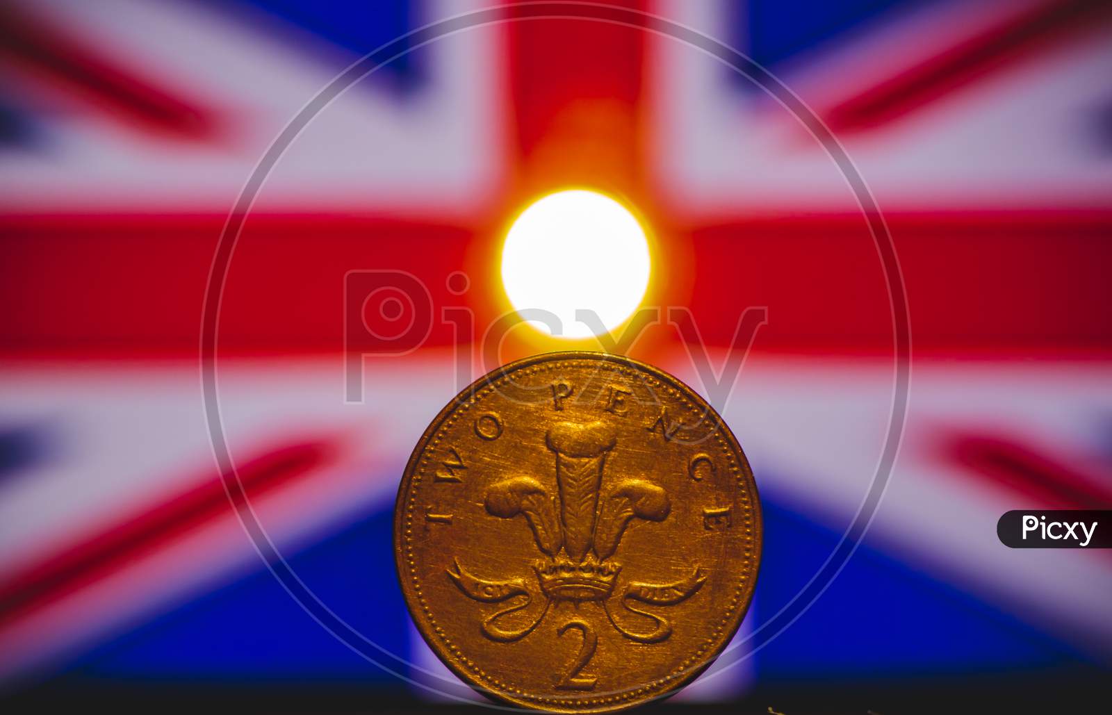 British Coin 2 Pence (2001) Isolated On (Uk) United Kingdom Flag Background And Lighting With Space For Copy Text. Front Side Of Two Pence Coin. England Coins Collectors World Wide.