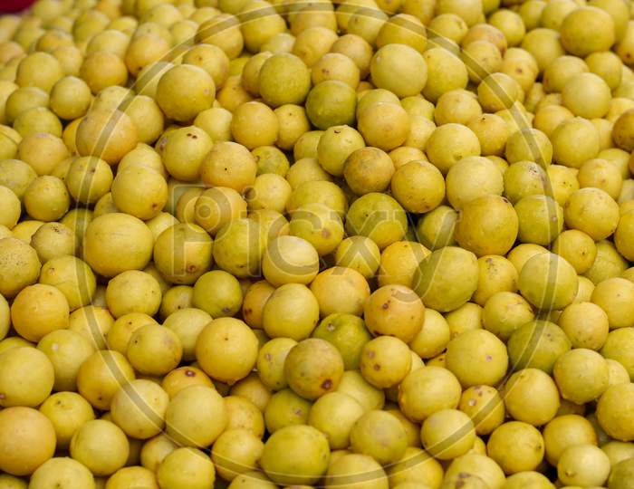 Lot Of Yellow Lemons In A Market