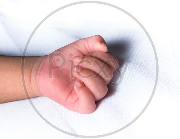 Closeup Shot Of The Isolated Hand Of A Baby In A White Background