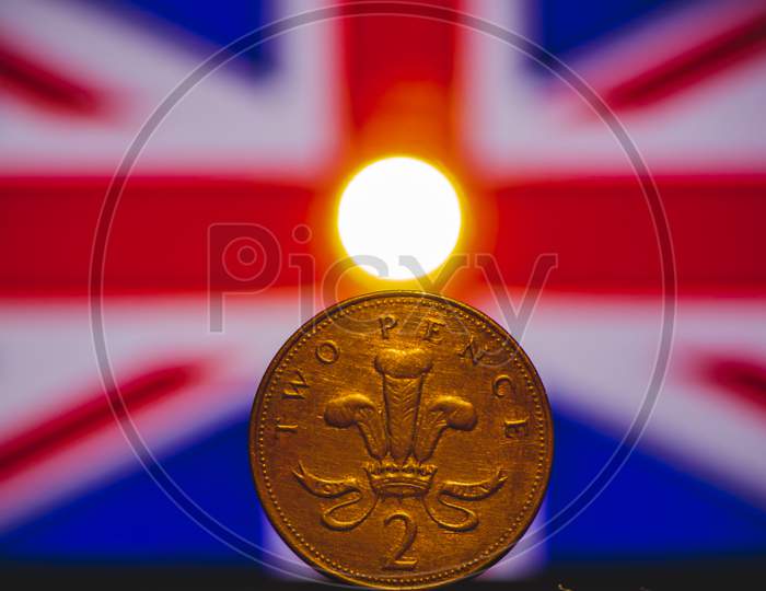 British Coin 2 Pence (2001) Isolated On (Uk) United Kingdom Flag Background And Lighting With Space For Copy Text. Front Side Of Two Pence Coin. England Coins Collectors World Wide.