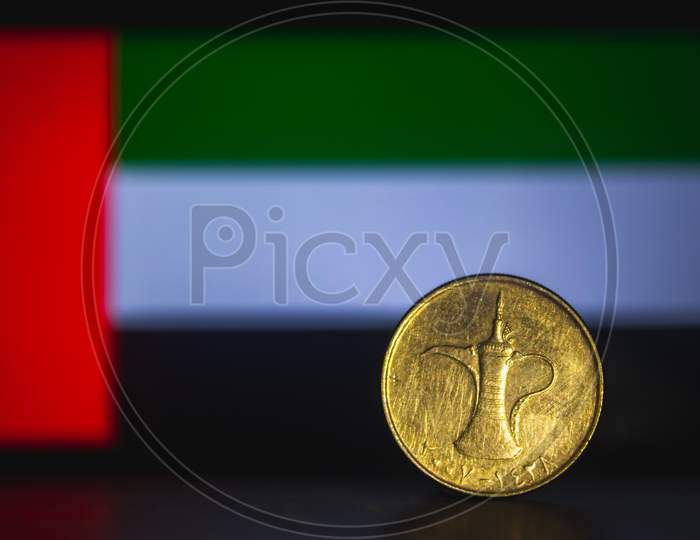 United Arab Emirates Dirham - One Dirham Coin Of Uae Isolated On United Arab Emirates Flag Background. Uae Currency 1 Dirham Coin With Space For Text Copy