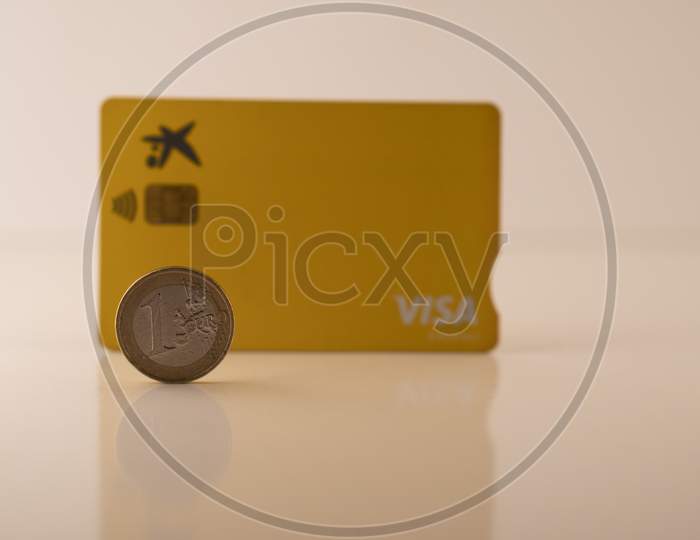 one euro coin and debit visa card