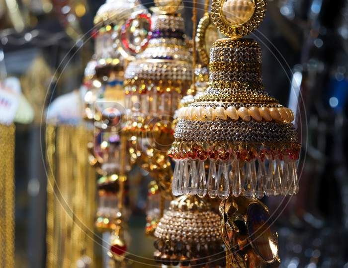 Large Earrings Held At A Shop For Selling