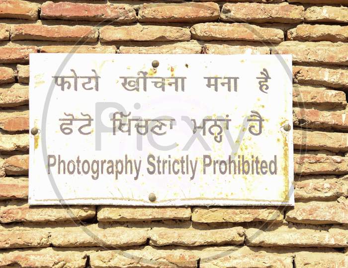 An Instruction Plate Stating 'Photography Strictly Prohibited'