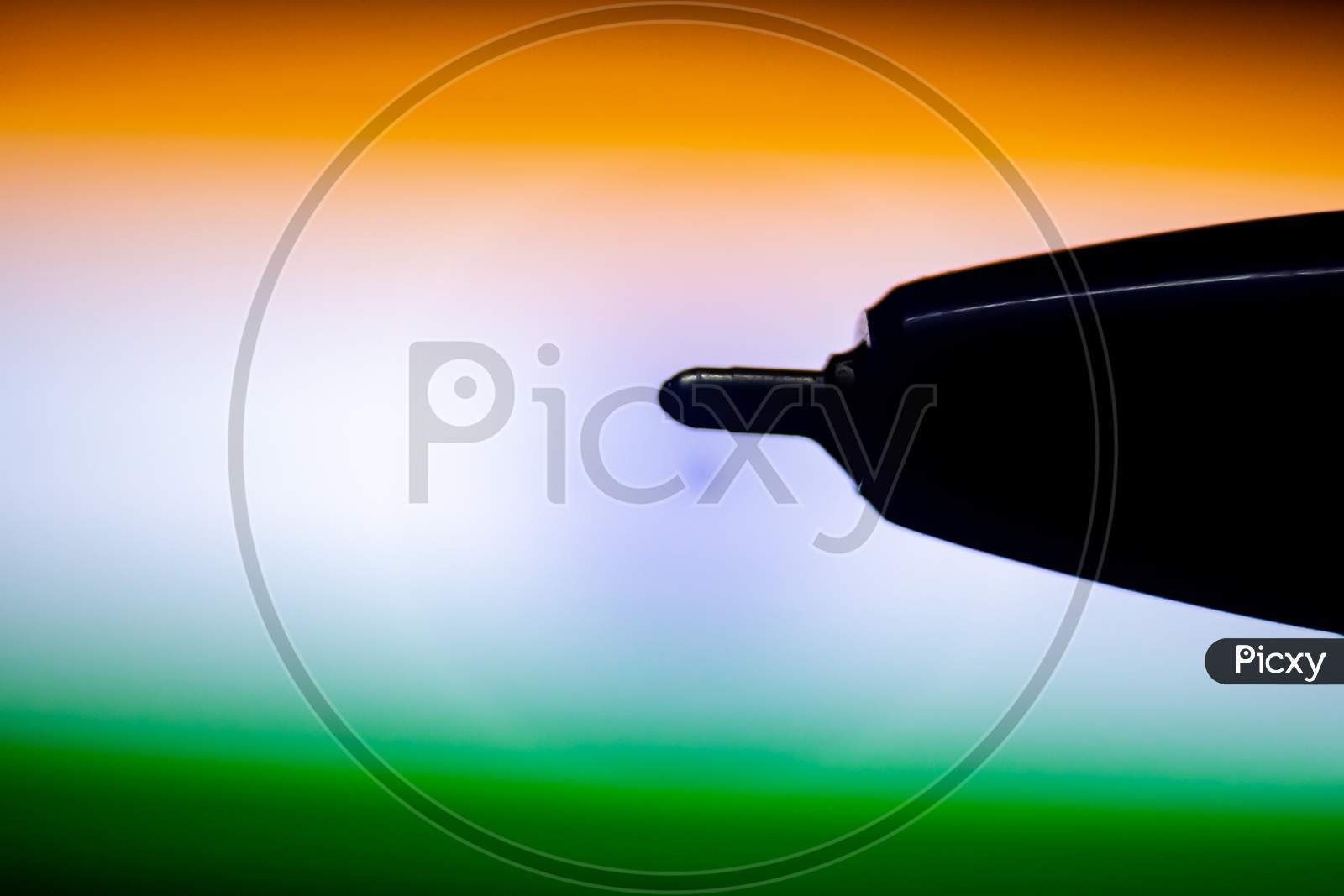 Close Up Of Black Ball Pen Head With Isolated On Indian Flag Color Background. Ballpoint Pen Head With Copy Space.