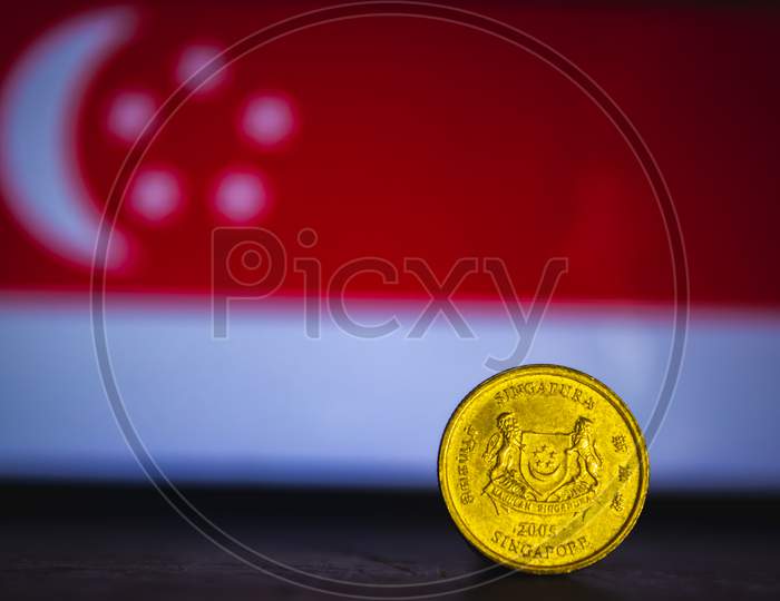 Singapore Currency - Five Cent Coin Of Singapore Isolated On Singapore Flag Background. Singapore Dollar 5 Cent Coin With Space For Text Copy