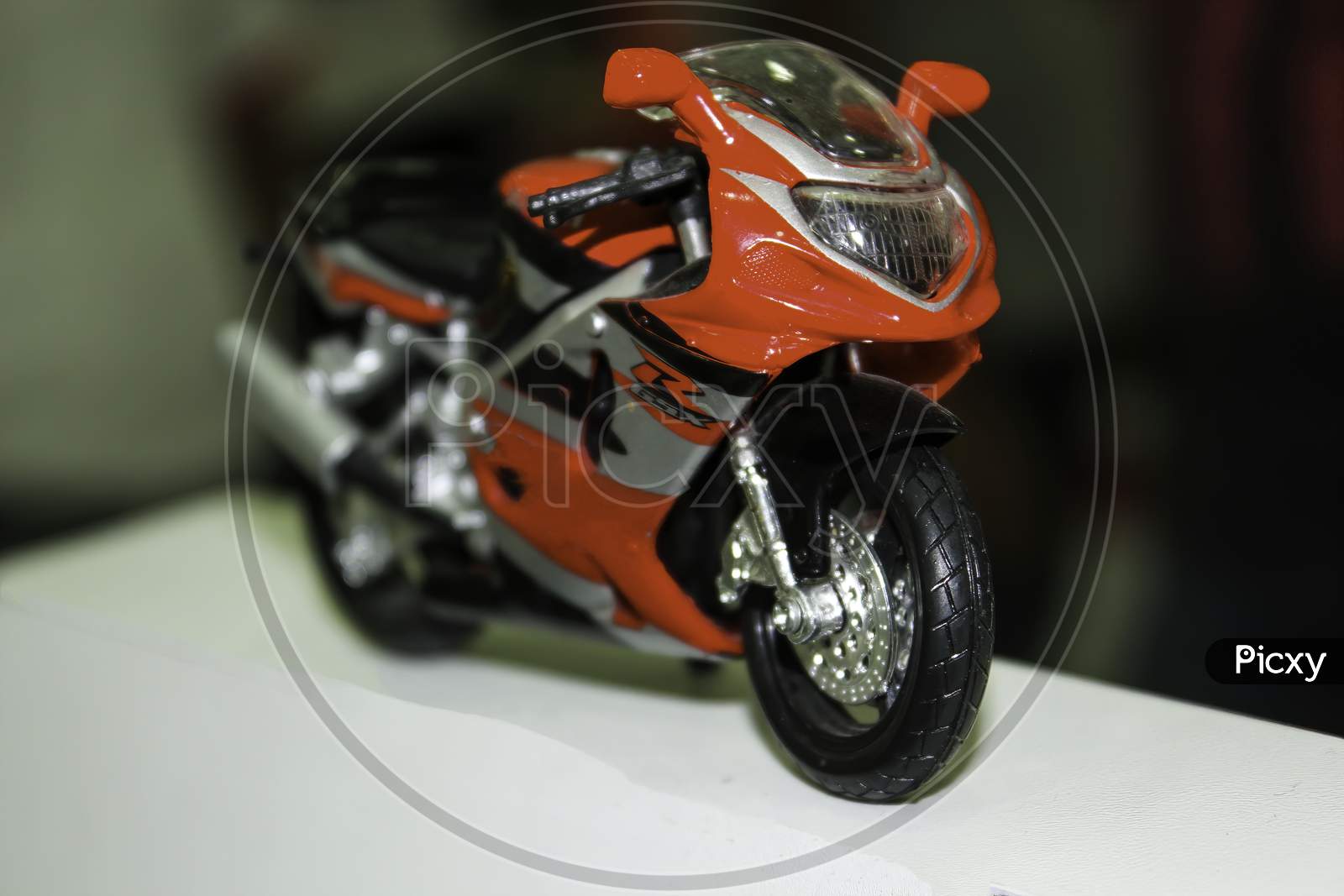 Close Up A Tiny Random Red Toy Bike Replica Of Suzuki