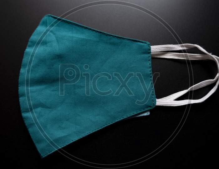 Colored Face Mask Isolated On A Black Background