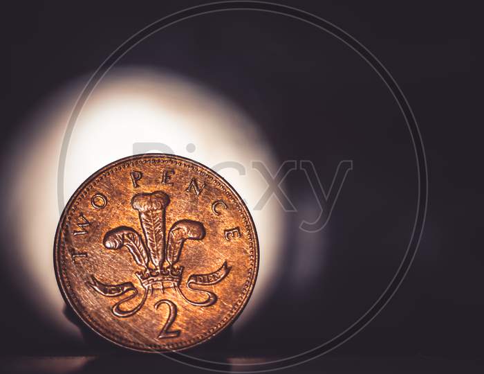 British Coin 2 Pence (2001) Isolated On Vintage Dark And Lighting Background With Space For Copy Text. Front Side Of Two Pence Coin. England Coins Collectors World Wide.