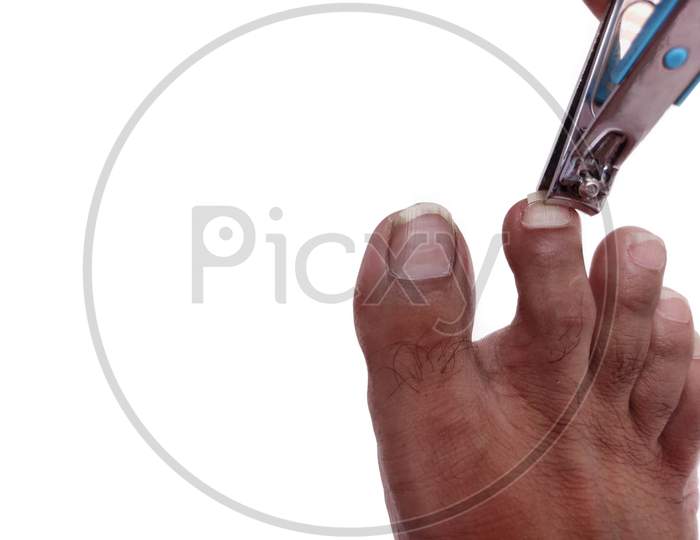 Foot nails self cutting by cutter on white background space for text.