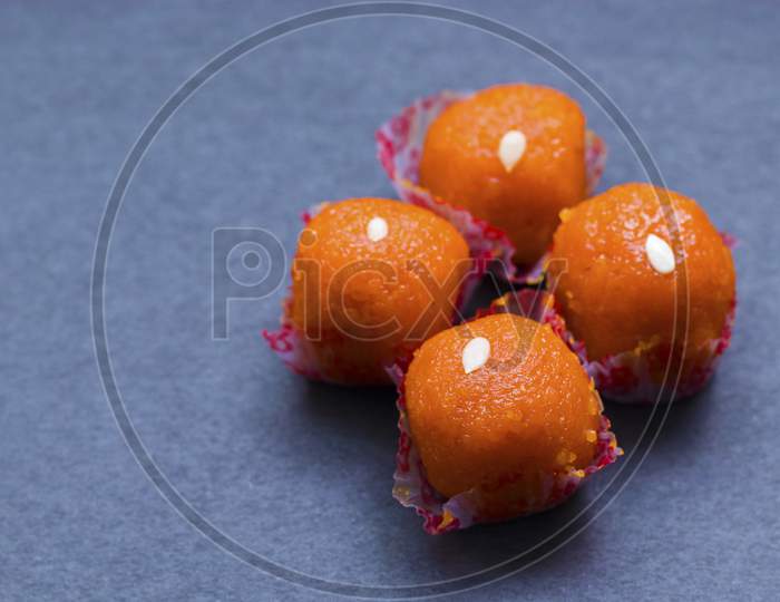 delicious sweet "laddu" with a black background.