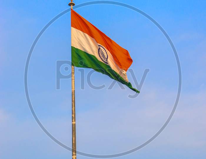 India Flag With Clear Blue Sky In The Background