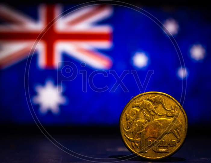 Australian Dollar Coin Isolated On Australia Flag Background With Space For Copy Text. One Dollar Coin 1995 Australian Currency. Old Coins Collection World Wide.