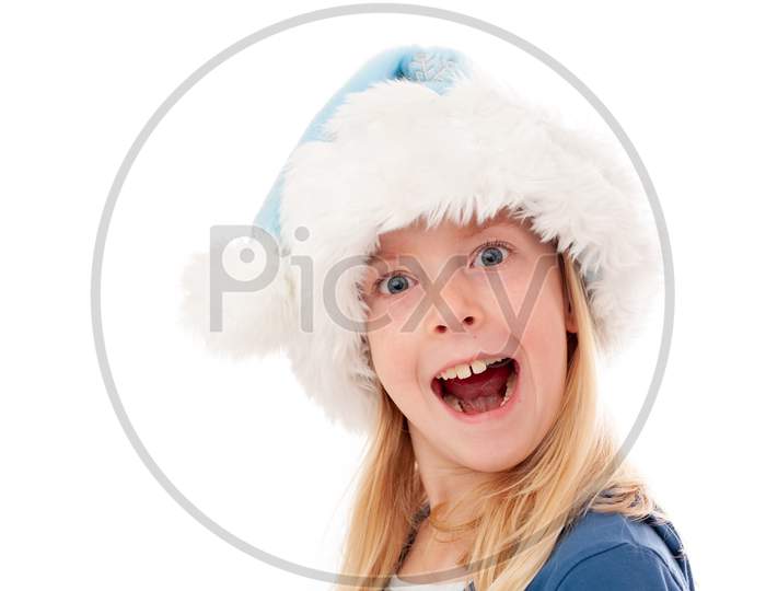 A Very Excited Young Blonde Girl In A Christmas Hat