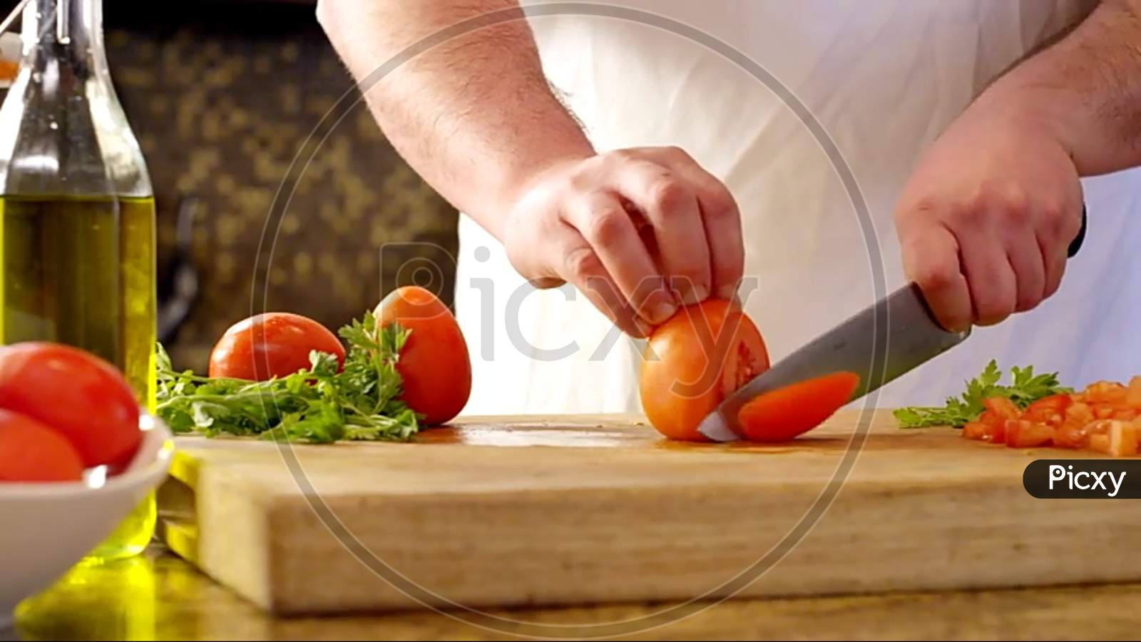 woman slicing tomato