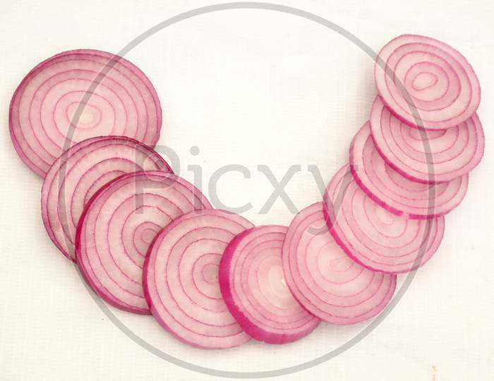 sliced the pink onion isolated on white background.