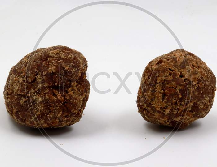 two-piece of DESI jaggery on white background