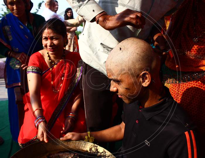 Almora, Uttrakhand / India - May 26 2020 : A Close Of A Hand And A Head While Cutting Hairs, Indian Tradition Of Cutting Hair During Janew Sanskar.