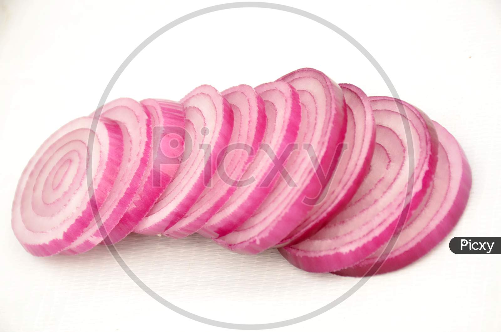 sliced pink white onion isolated on white background