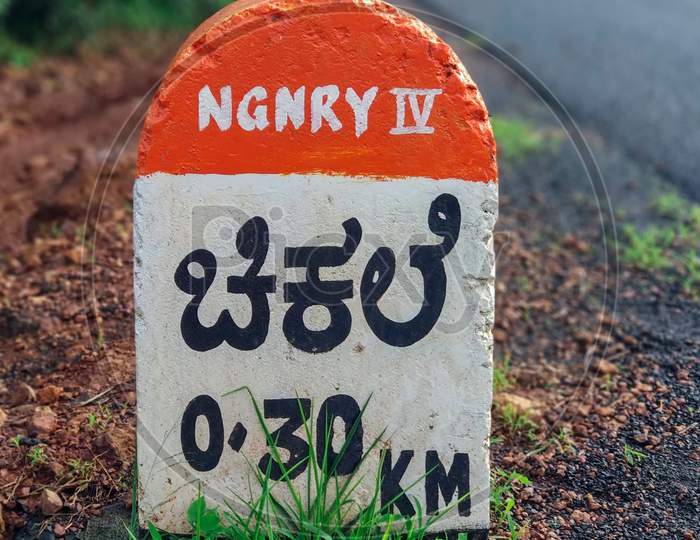 Milestone On A Rural Road At Chikhale Village Near Belgaum Karnataka.