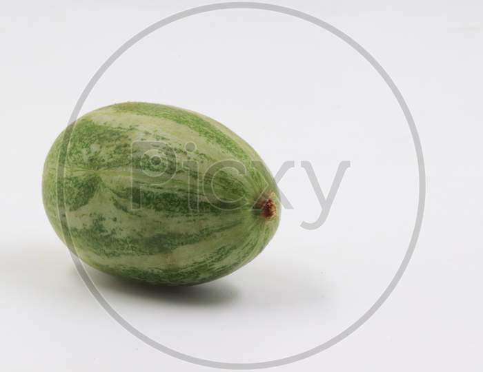 pointed gourd on white background with rule of third
