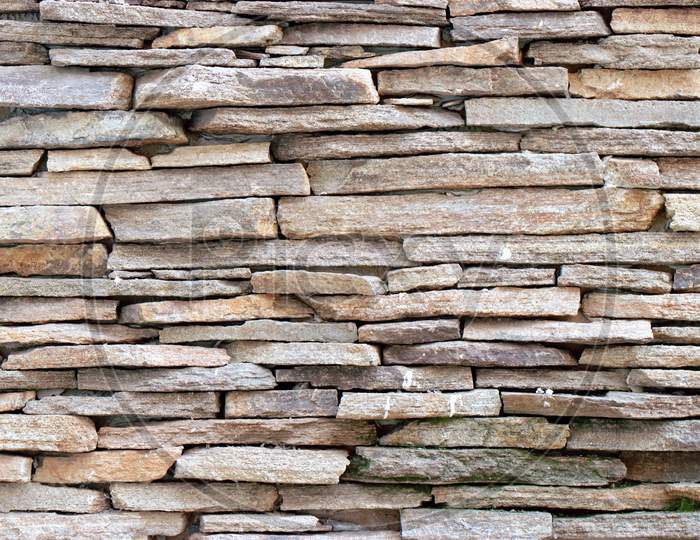 Organised stone wall brick work or stone work wallpaper