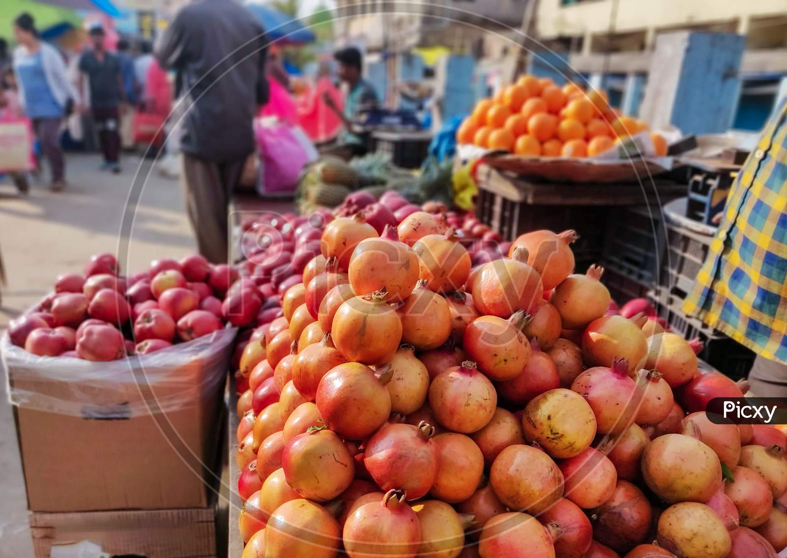 Heap Of Farm Fresh Pomegranates Kept On A Cart For Sale In A Indian Fruit Market