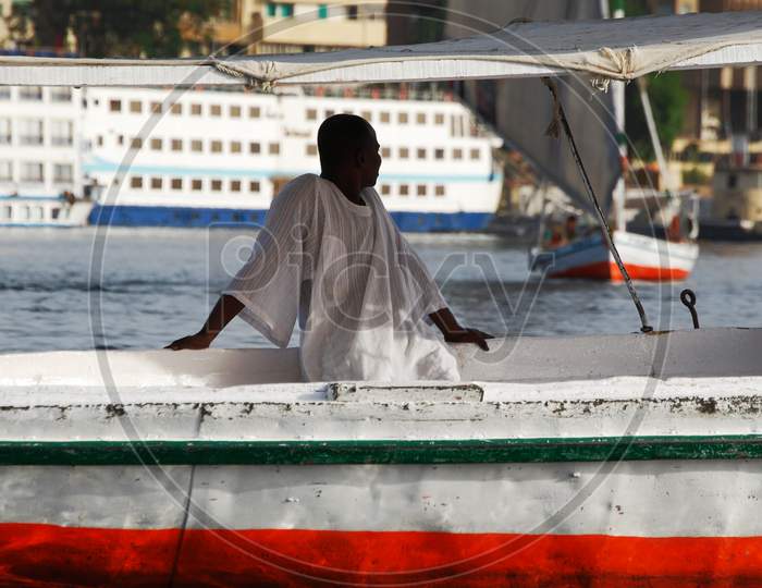 Nubian sailor sailing on the Nile river.