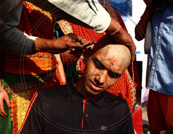 Almora, Uttrakhand / India - May 26 2020 : A Close Of A Hand And A Head While Cutting Hairs, Indian Tradition Of Cutting Hair During Janew Sanskar.