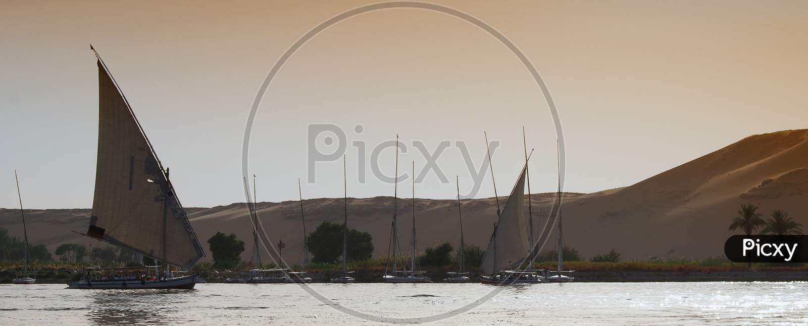 Boats on the Nile river near the Nubian village. Aswan, Egypt