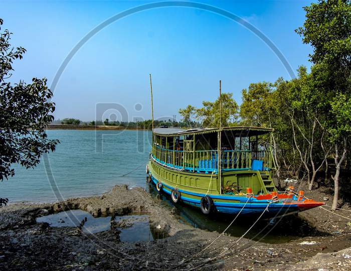 A Boat Is Waiting At Riverside For High Tide At Sundarbans