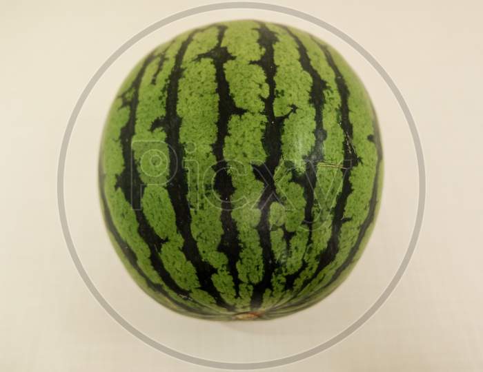 Whole striped watermelon with white background