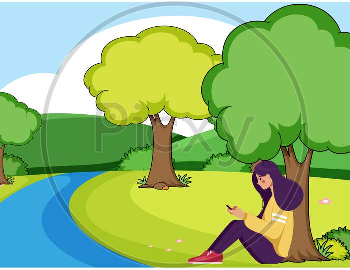 Girl Sitting Near To The River And Using Phone