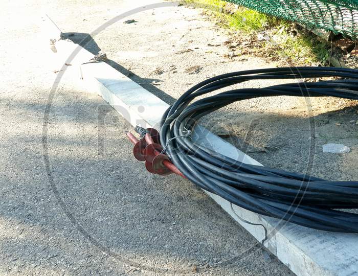 Electric Pipe Black Wire On Road