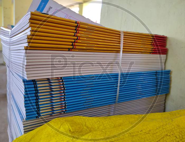 Bundle Of Multicolored Exercise Books Are Ready To Distribute To School Students. Bunch Of School Edge Book.