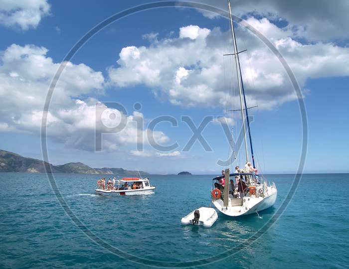 Two excursion boats off the coast of Zakynthos Greece.  .