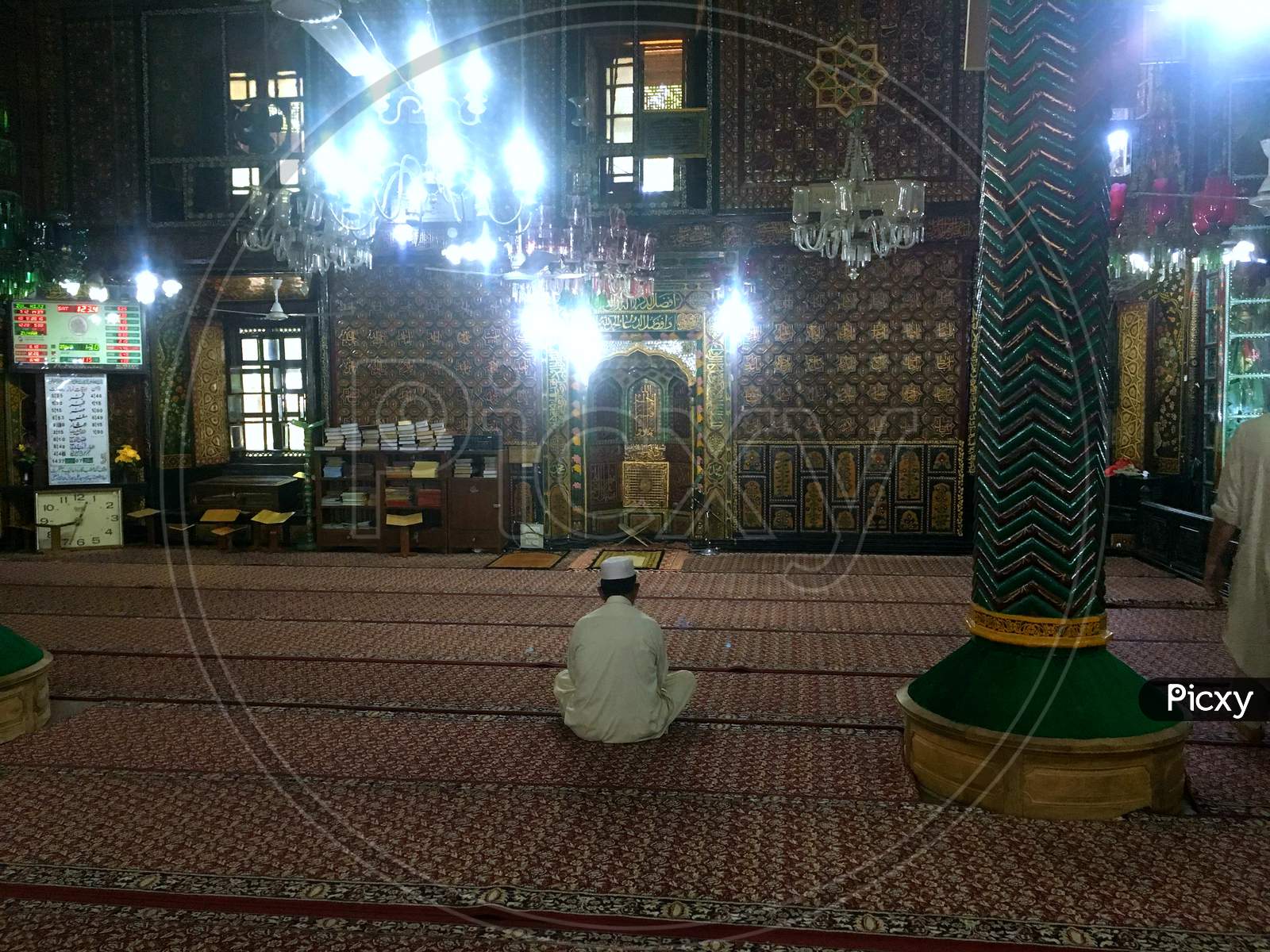Masjid And A Man Prays In Old Downtown Area