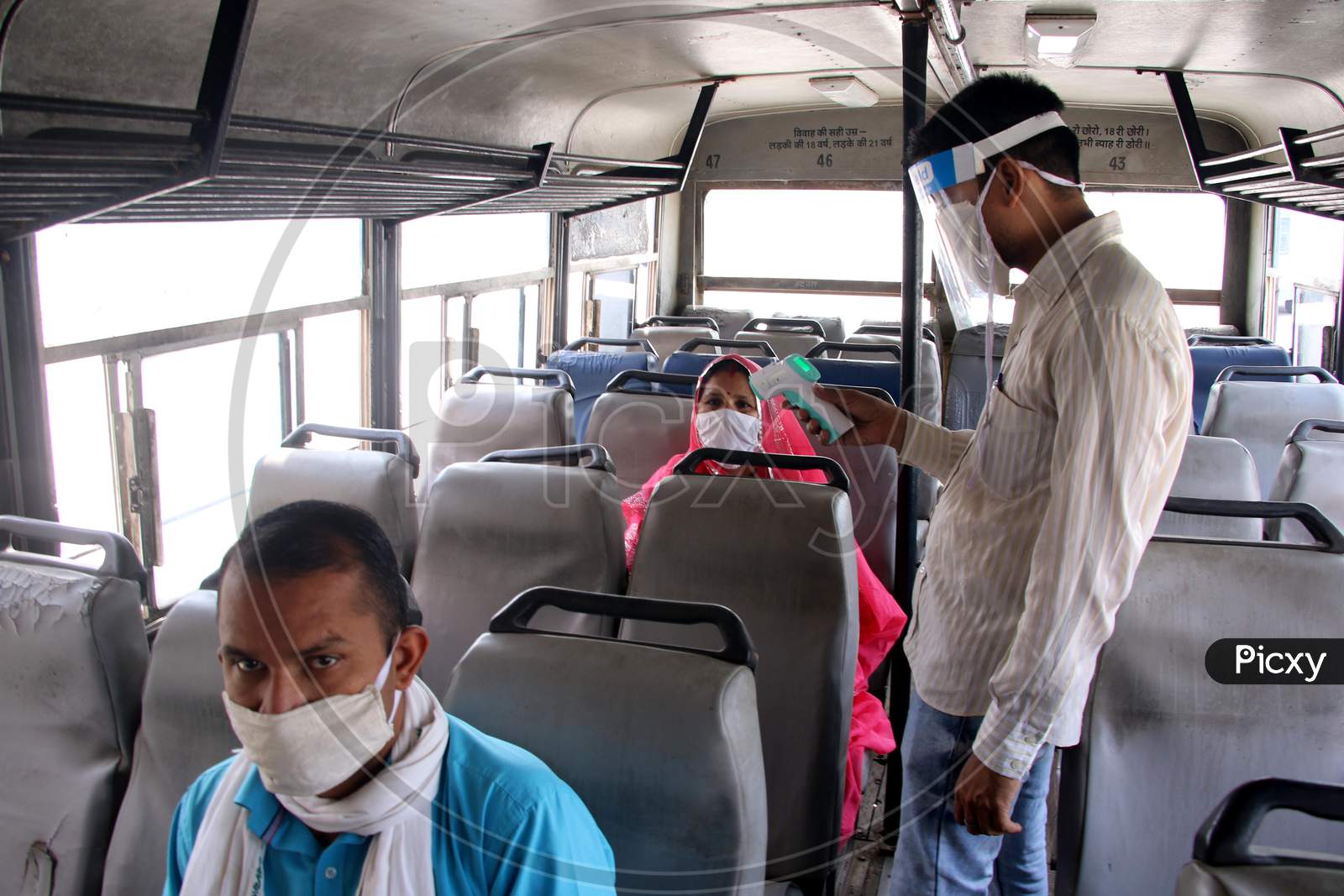 Passengers Undergo Thermal Screening As They Board A Public Bus Following Ease Of Restrictions, During The Fifth Phase Of Covid-19 Lockdown In Ajmer, Rajasthan, India On 03 June 2020.