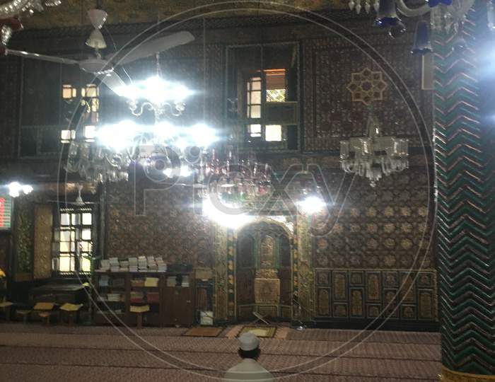 Interior Masjid And A Man Prays In Old Downtown