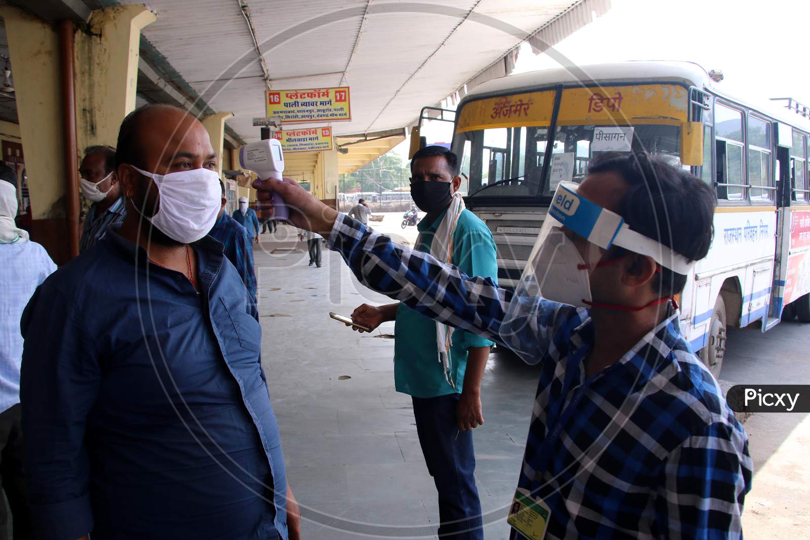 Passengers Undergo Thermal Screening As They Board A Public Bus Following Ease Of Restrictions, During The Fifth Phase Of Covid-19 Lockdown In Ajmer, Rajasthan, India On 03 June 2020.