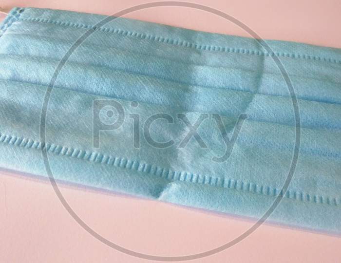 Close up of a medical surgical protective face mask on white background