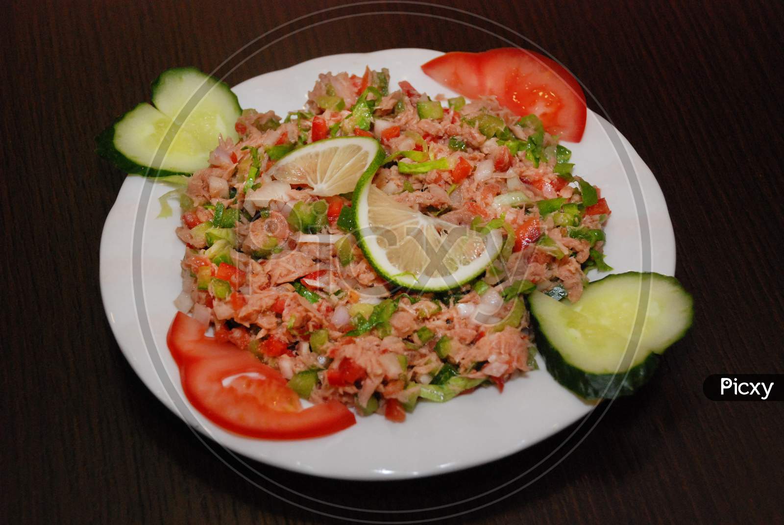 Vegetable Salad With Tuna On The White Plate