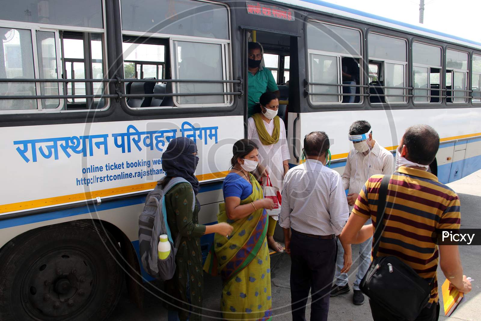 Passengers Undergo Thermal Screening As They De-Board A Public Bus Following Ease Of Restrictions, During The Fifth Phase Of Covid-19 Lockdown In Ajmer, Rajasthan, India On 03 June 2020.