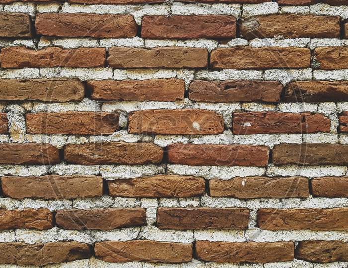 Brick Wall With Cement Mortar Close-Up.