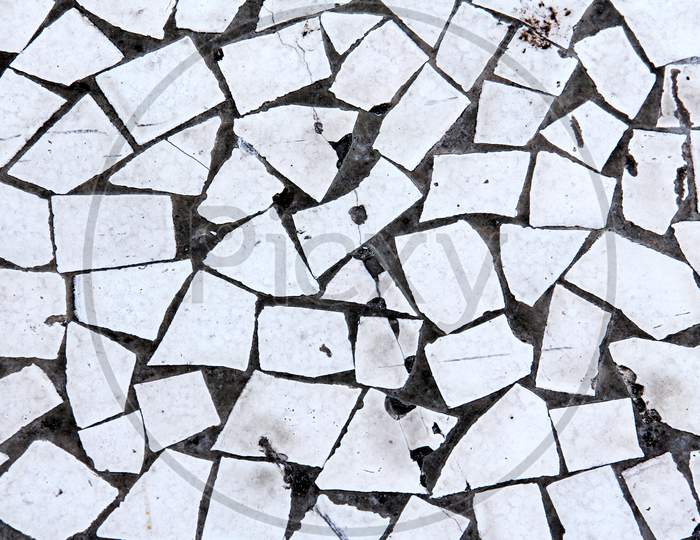Top View Of Worn Out Vintage White Abstract Tile