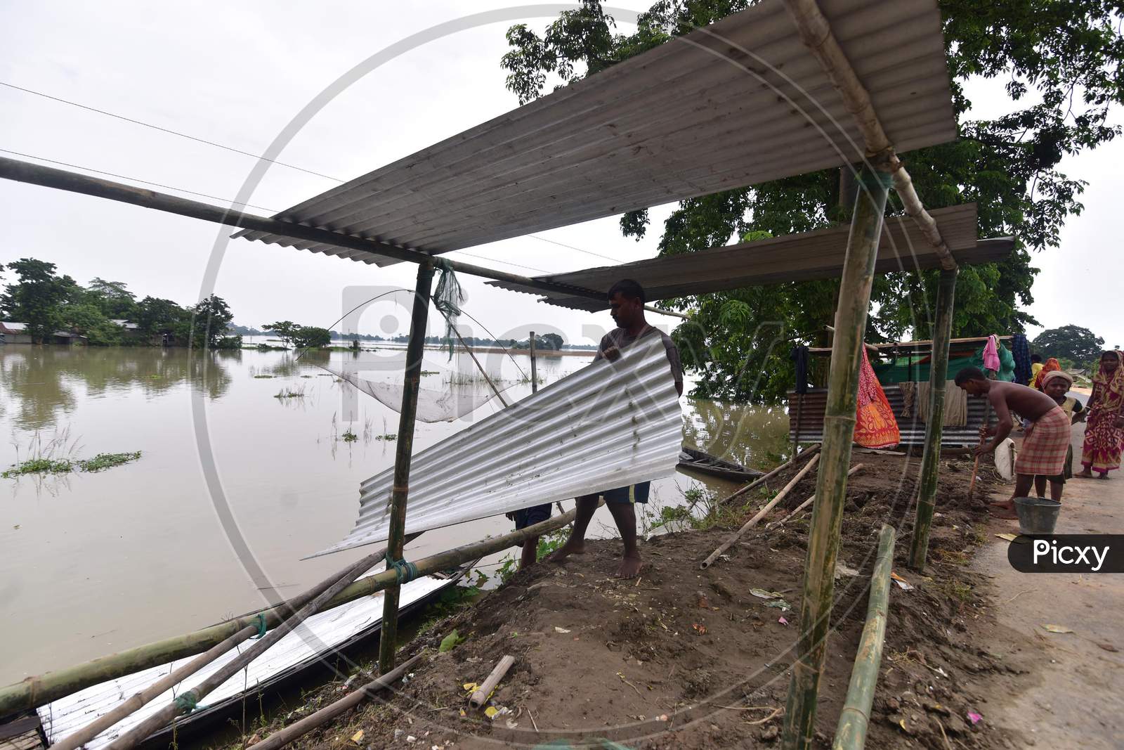 Flood Affected Villagers Prepare To Make A Camp To  Take Shelter At Mayong Village In Morigaon District Of Assam On June 29,2020.