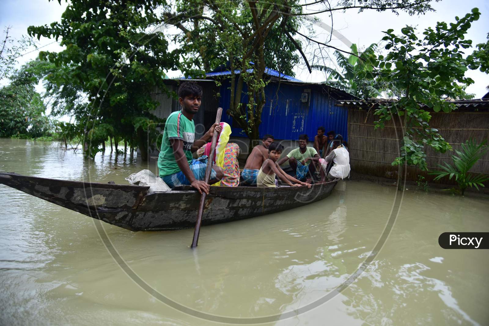 Flood Affected Villagers Are Transported On A Boat  Towards A Safer Place In Morigaon District Of Assam  on june 29,2020.