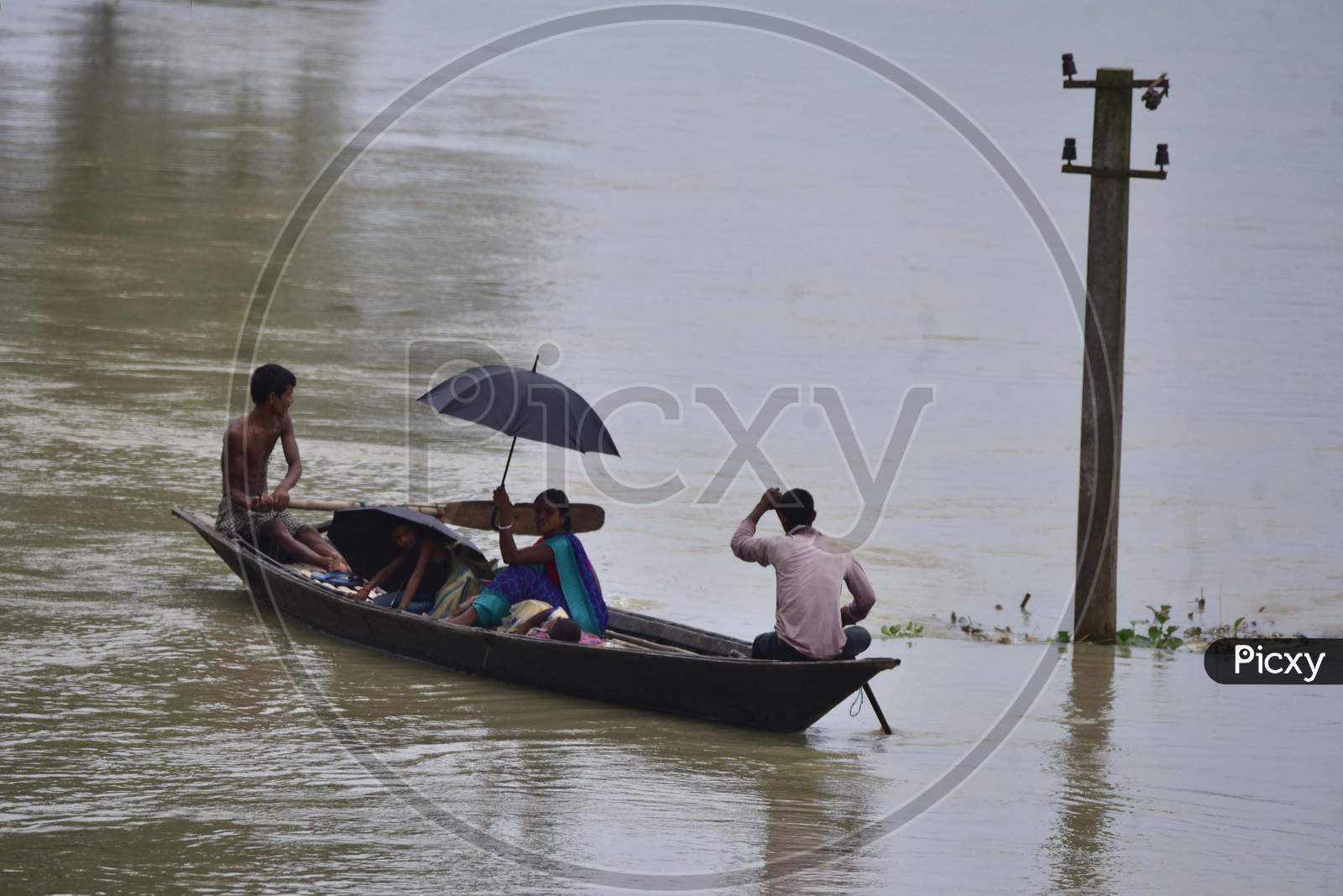 Flood Affected Villagers Are Travel On A Boat Towards A Safer Place During Floods  At  Sildubi Village In Morigaon District Of Assam On June 29, 2020