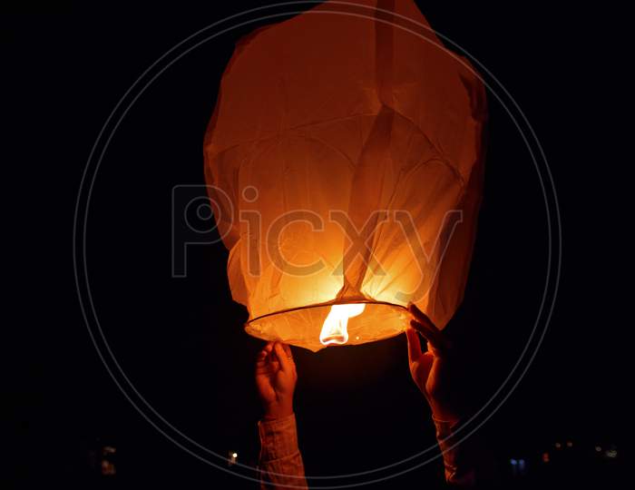 sky lantern, also known as Kongming lantern or Chinese lantern in black sky