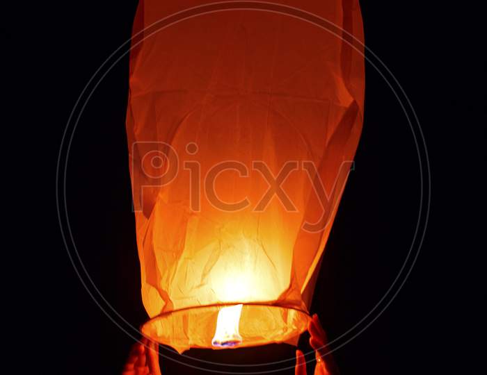 sky lantern, also known as Kongming lantern or Chinese lantern in black sky